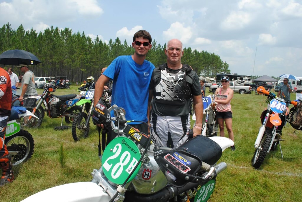 Tom with his son Tyler at a dirt-bike event